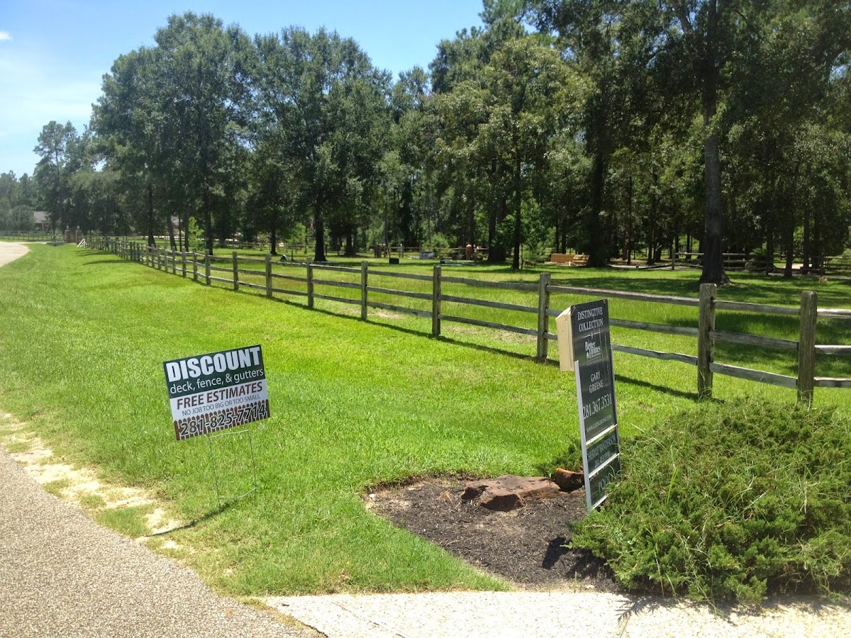 Discount Deck yard sign with completed ranch fence